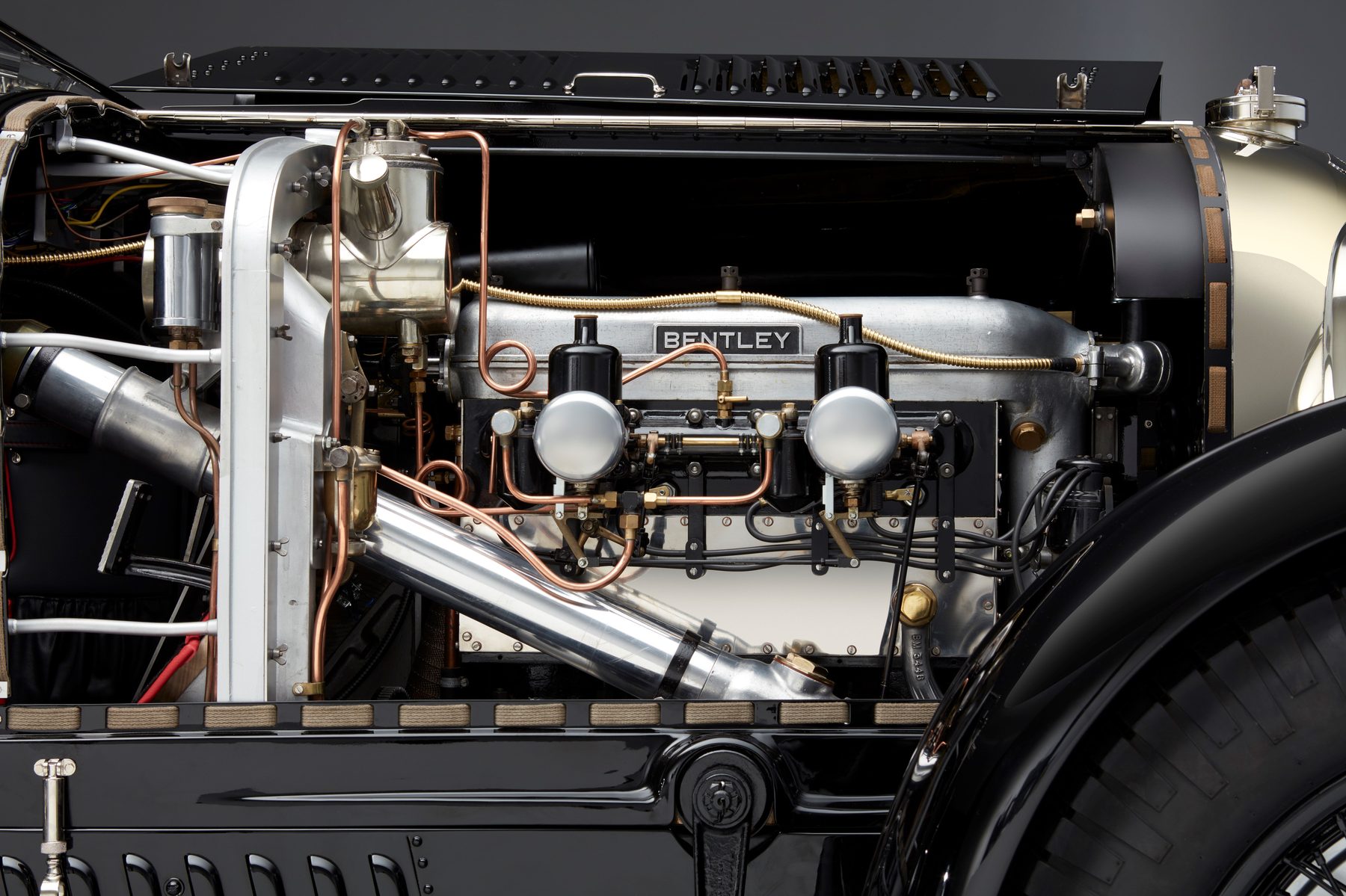 The 5.3 litre four-cylinder engine with twin SU carburettors, copper and brass fittings